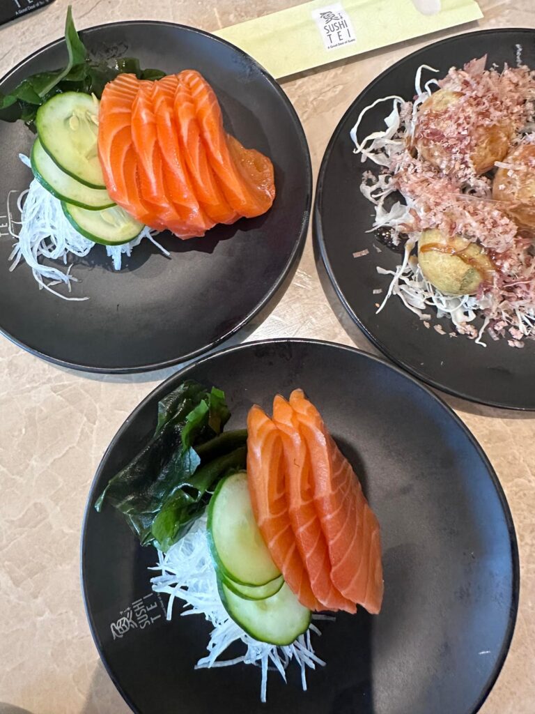 Salmon sashimi, takoyaki & spicy salmon head nabe