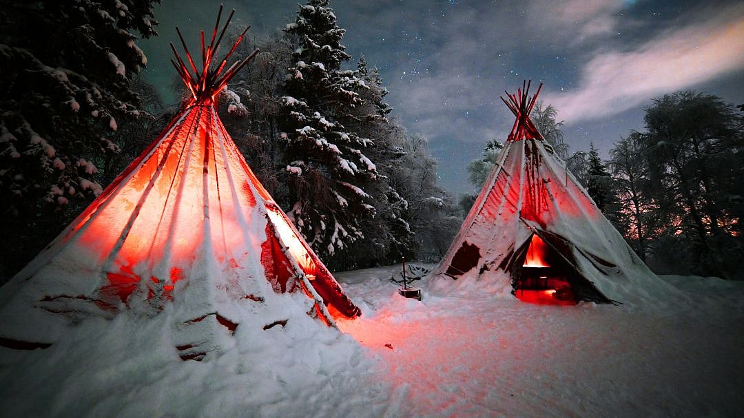 Staying in a tent or wooden cabin with snow piled outside your window is part of the charm of Lapland