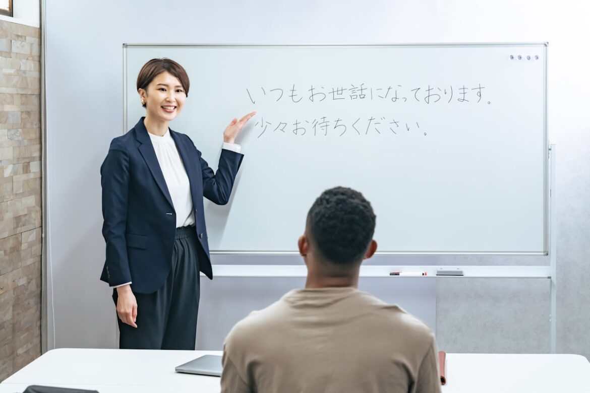 Woman teaching a man how to speak business japanese