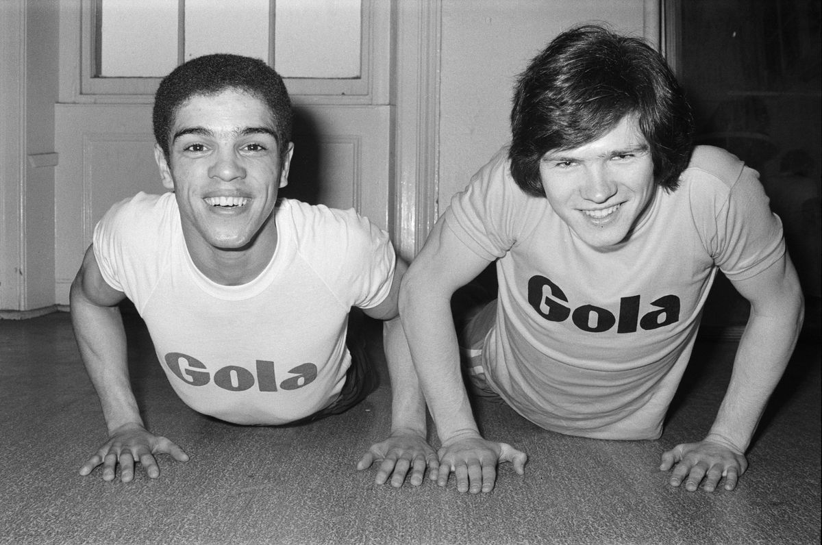 Boxer Vernon Sollas (left) and footballer Steve Perryman doing press ups. 25th March 1974.