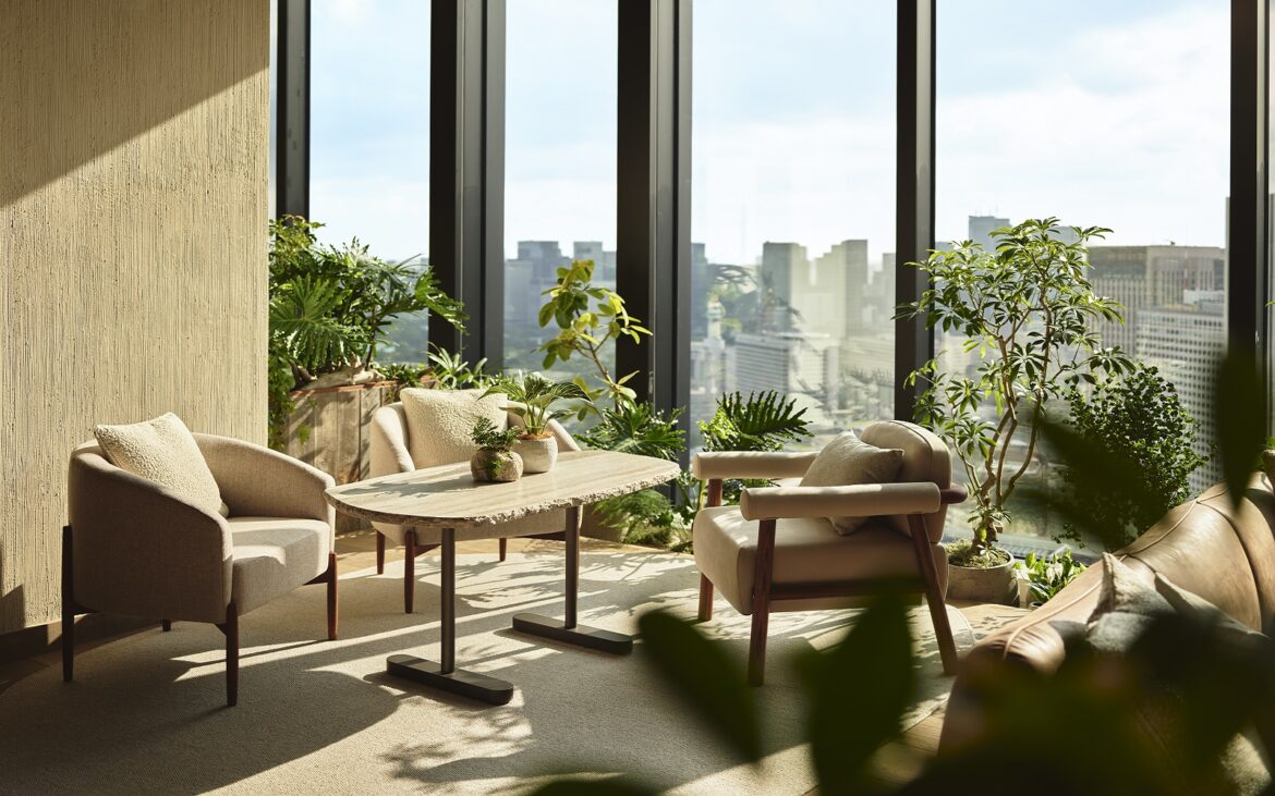1 Hotel Tokyo – redefining sustainable luxury in Japan’s capital • Hotel Designs lounge area in1 Hotel Tokyo with floor to ceiling windows with views over trees and city