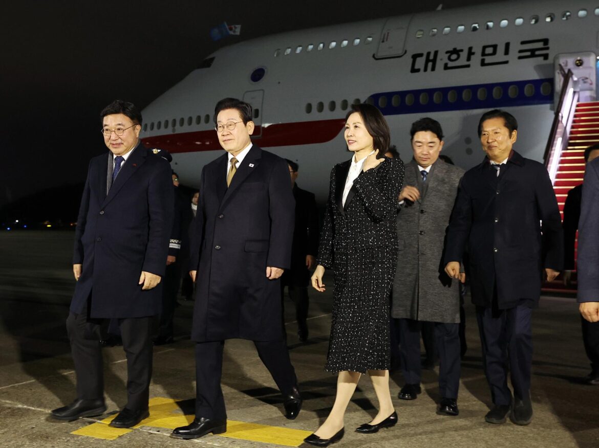 President Lee Jae Myung, second from left, and first lady Kim Hea Kyung arrive at Seoul Air Base in Seongnam, Gyeonggi Province, Wednesday, after completing an official visit to Japan. Yonhap