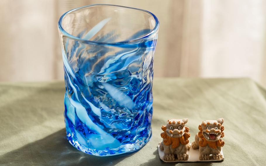 The glass Shoji made and a small Okinawan craft are on the table.