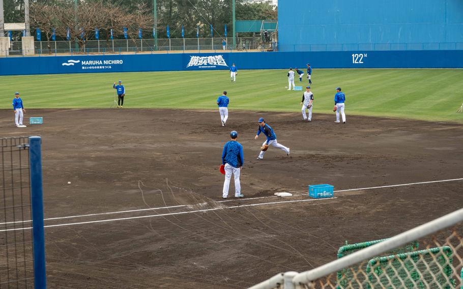 Yokohama DeNA BayStars players practicing during spring training.
