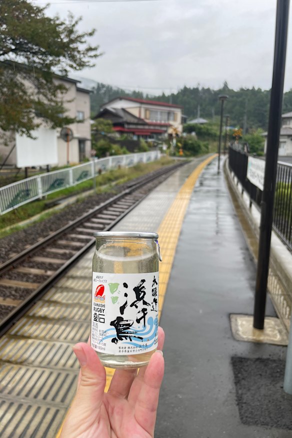 Leaving Namiitakaigan Station with a gift of sake.