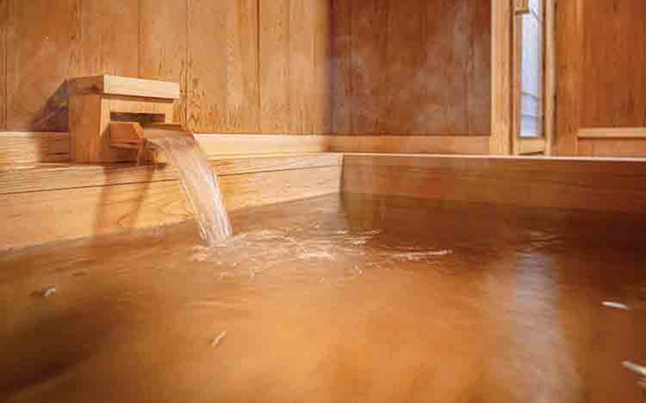 Hot water pouring into a bath.