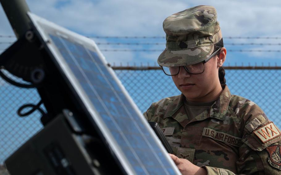 U.S. Air Force Airman 1st Class Faith Chavez, 18th Operations Support Squadron weather forecaster, checks readings on a standard weather sensor tower on Kadena Air Base, Japan, Jan. 12, 2026. 