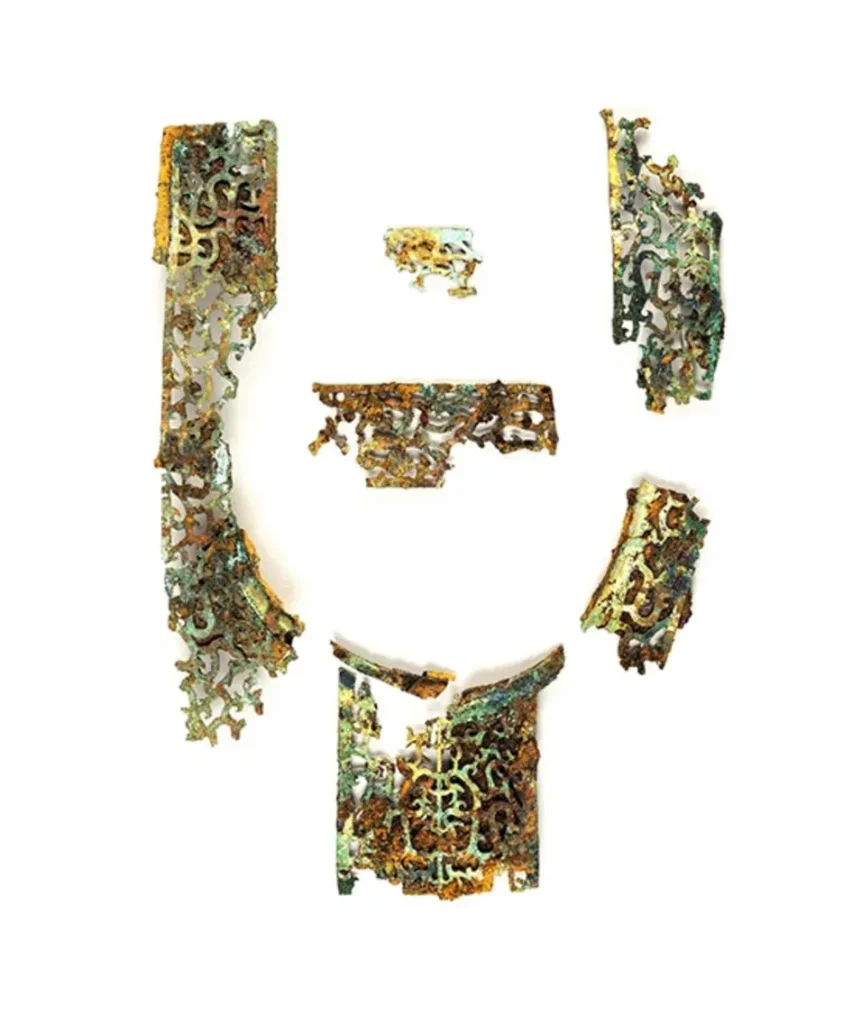 The shape of fragments suggests they were attached to the neck guard of a piece of armor. Credit: Meiji University Museum