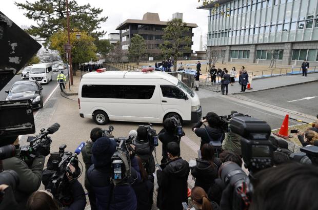 A vehicle carrying Tetsuya Yamagami, the defendant accused of fatally shooting Japan's former Prime Minister Shinzo Abe, enters the Nara District Court for his sentencing hearing in Nara, western Japan, Wednesday, Jan. 21, 2026. (Koki Ohada/Kyodo News via AP)