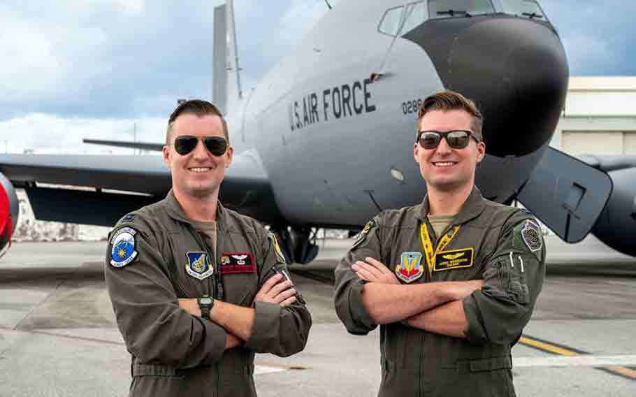 U.S. Air Force Capt. Jordan Wesemann, left, 909th Air Refueling Squadron instructor pilot, and Capt. Jared Wesemann, 4th Expeditionary Fighter Squadron pilot, deployed to Kadena Air Base, pose for a photo at Kadena AB.