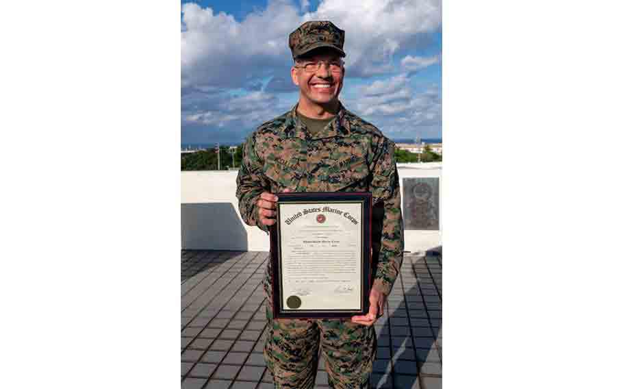 U.S. Marine Corps 1st Sgt. Christopher McCullar poses for a photo during his redesignation ceremony.