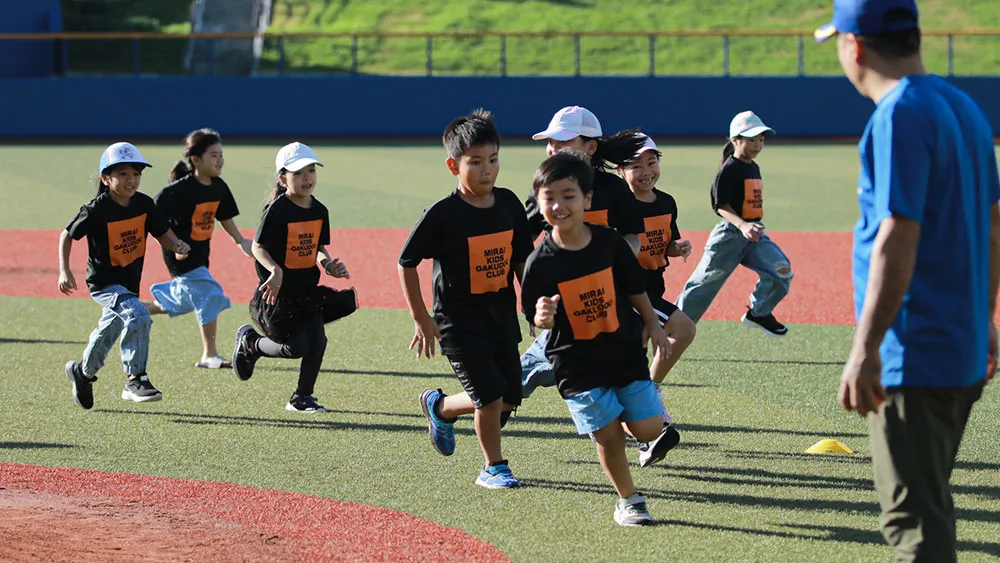 Children running energetically across the lawn [©JWL]
