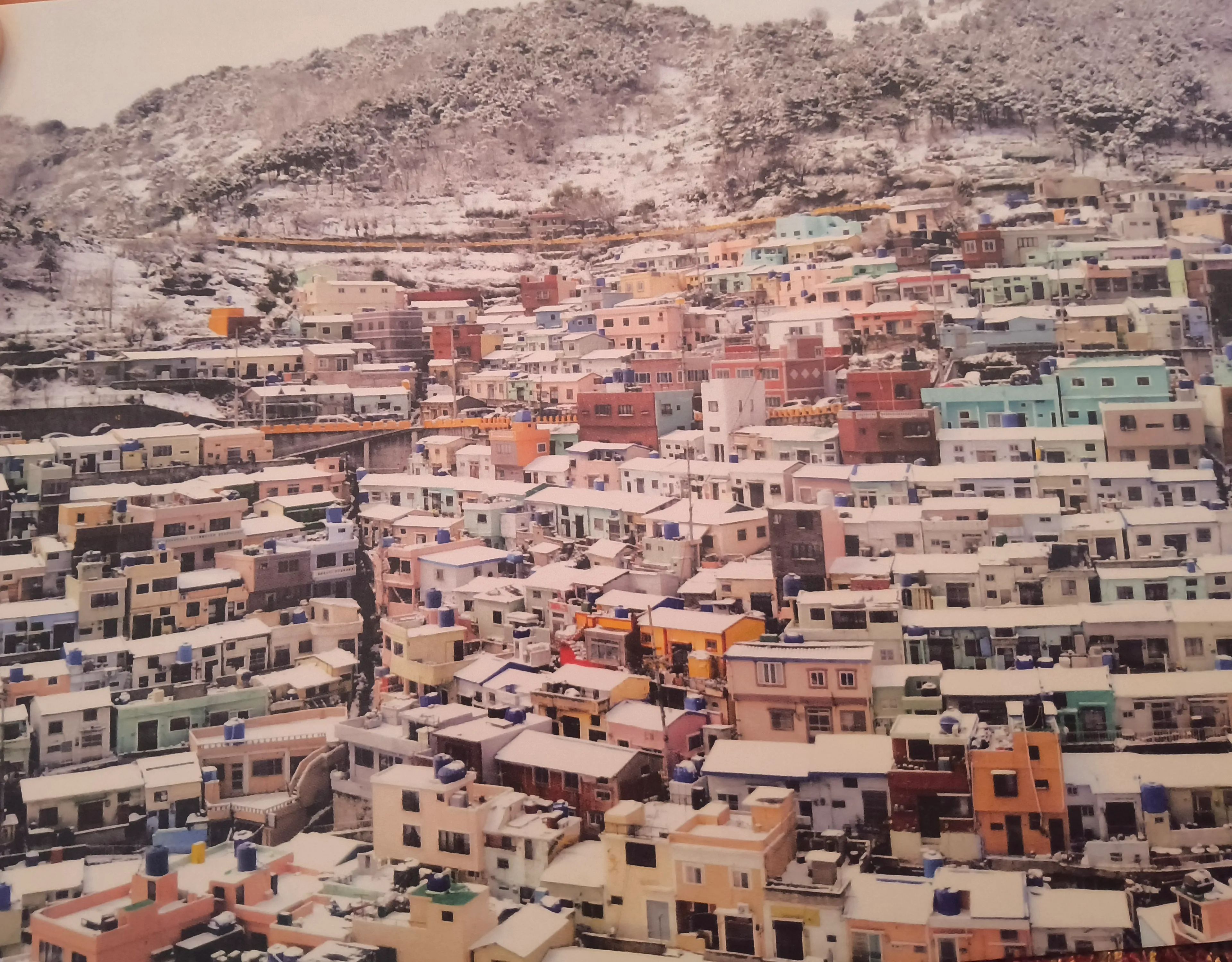 Gamcheon Culture Village in Busan, South Korea, is a vibrant, hillside neighborhood known for its colorful, terraced houses, labyrinthine alleys, and public art.