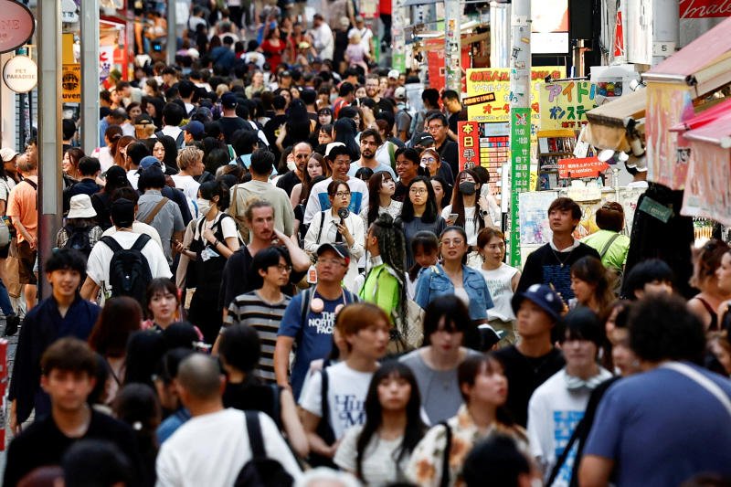 People walk along Takeshita Street in the Harajuku shopping area in Tokyo on Aug 10, 2024. (Photo: Reuters)