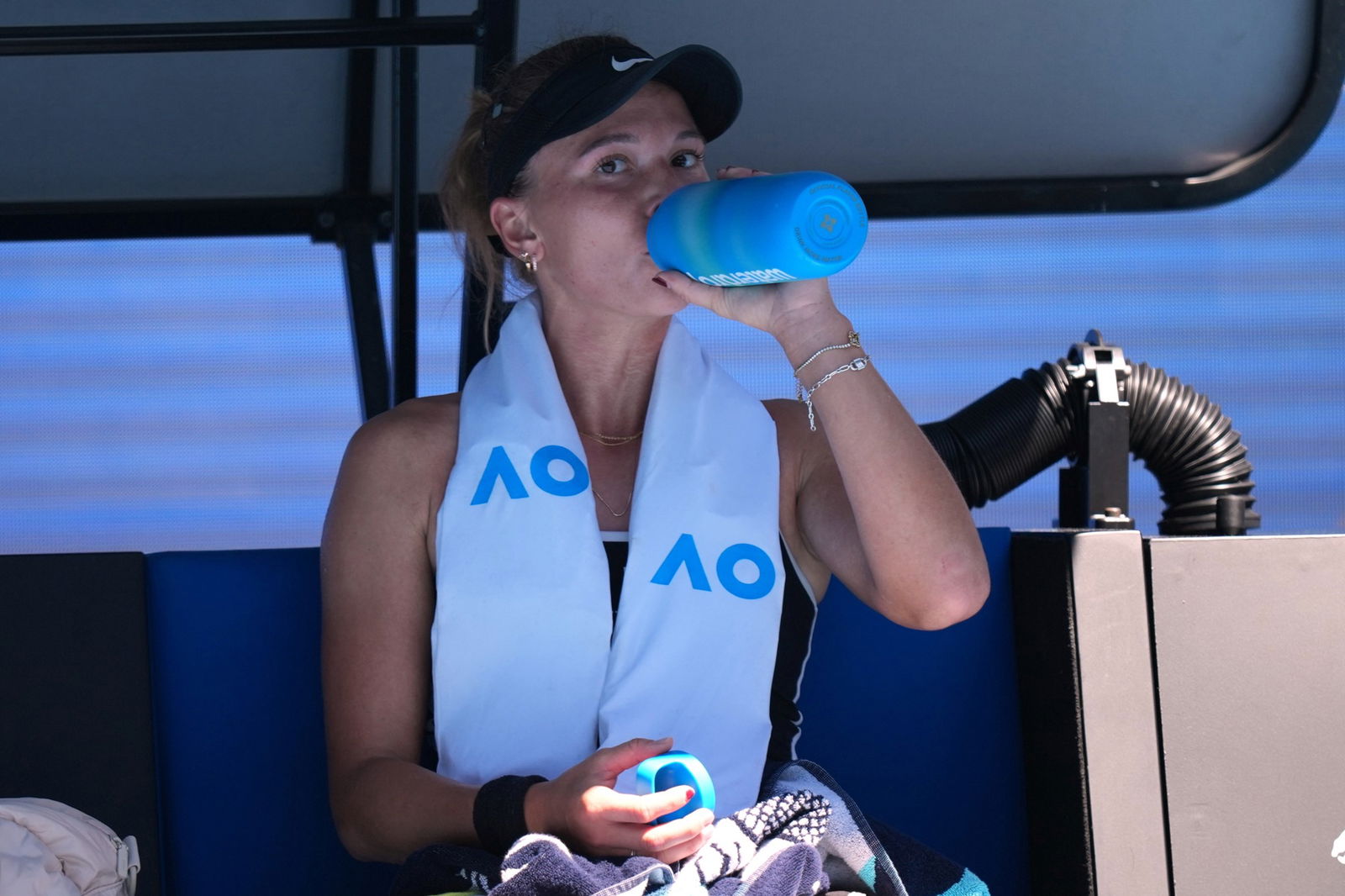 A player takes a drink of water.