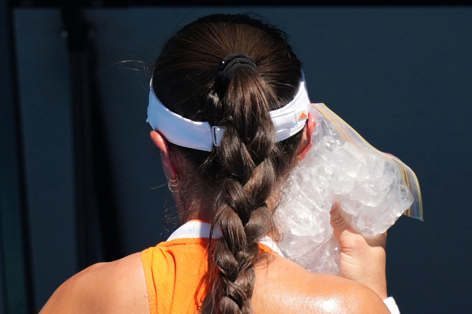 Jess Pegula uses an ice pack on her face.