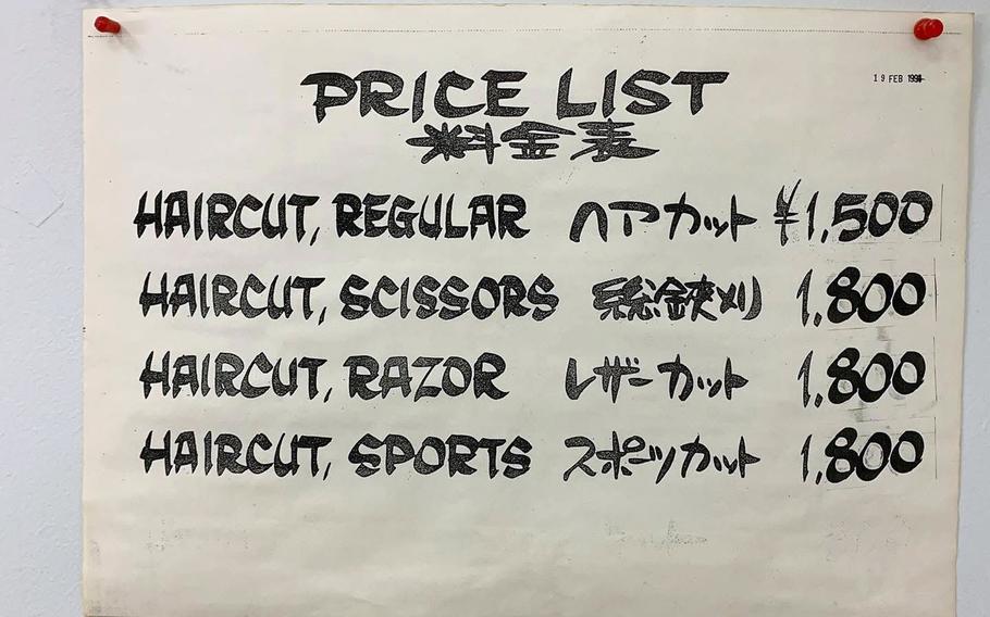 A price list for haircuts.