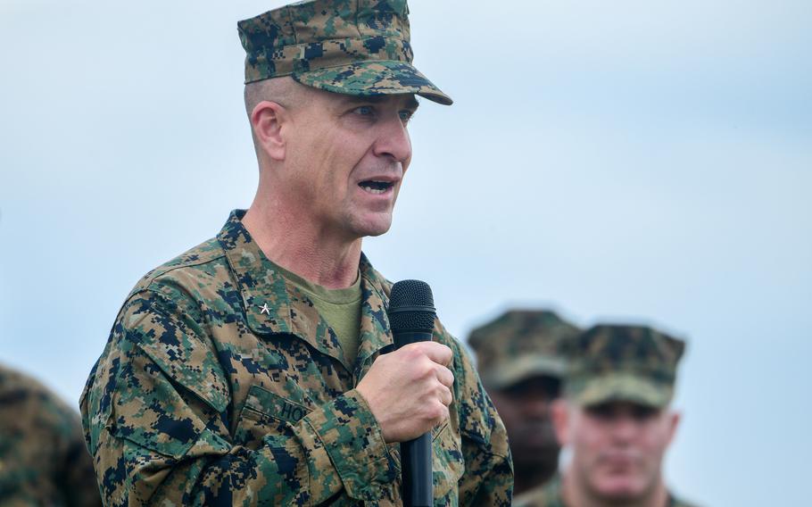 Ryan Hoyle, a one-star general, addresses the audience at a change-of-command ceremony.