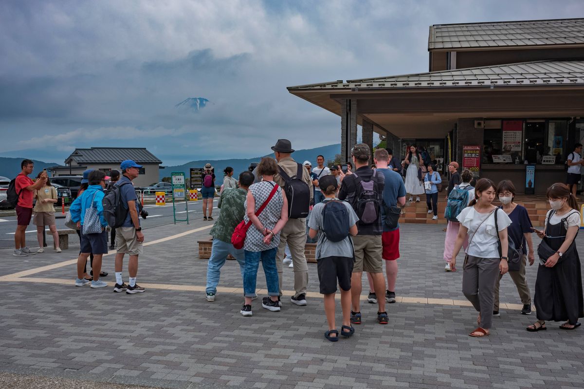 Fuji Hakone-Izu National Park, Japan, Jun 17, 2024: Tourists explore  Mt. Fugi, along the Mt. Komagatake Ropeway during a cloudy, summer day. The attraction is a popular Japanese travel destination.