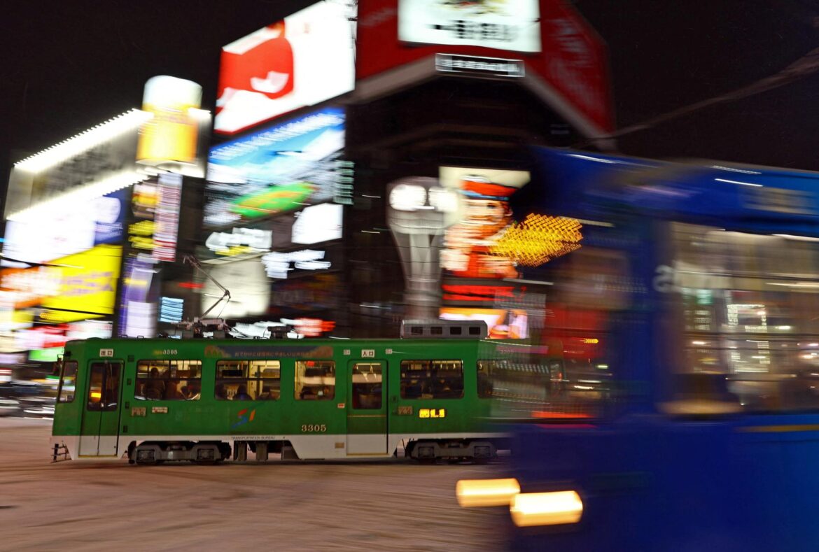 Sapporo streetcars, known locally as Shiden, run in a loop through central Sapporo, including along the streets of the Susukino district on Hokkaido, Japan