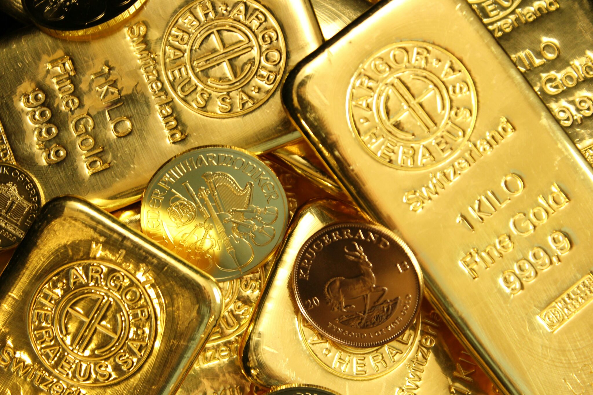 A stack of golden bars and coins