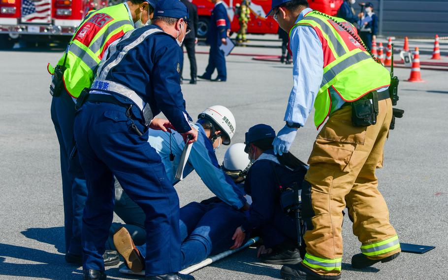 Local emergency response agencies attend to casualty actor during training.