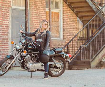 Rider sitting on a black 2023 Yamaha V-Star 250