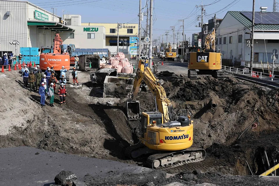 Workers construct a slope to aid rescue operations at the site of the sinkhole in Osaka on Feb. 1, 2025 STR/JIJI PRESS/AFP via Getty