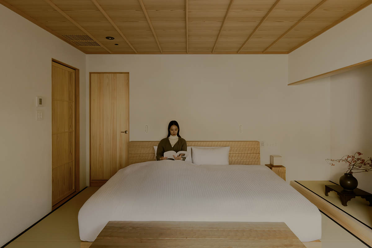 kooo architects creates a wooden interior sanctuary for contemporary accommodation in Kyoto City
