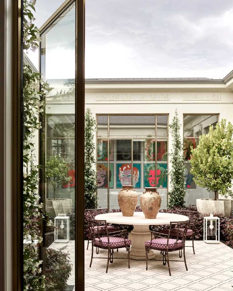 A courtyard with windows framing pop art