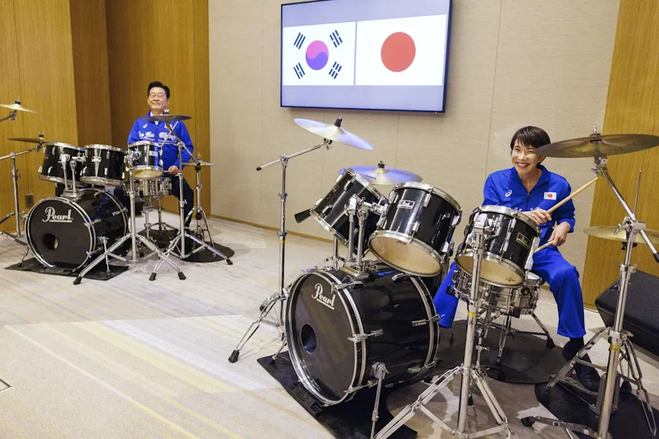 FILE - In this photo provided by the Prime Minister's Office of Japan, Japanese Prime Minister Sanae Takaichi, right, and South Korean President Lee Jae Myung play drums together after their talks in Nara, western Japan, Jan. 13, 2026. (Prime Minister's Office of Japan via AP, File) (Prime Minister's Office of Japan)