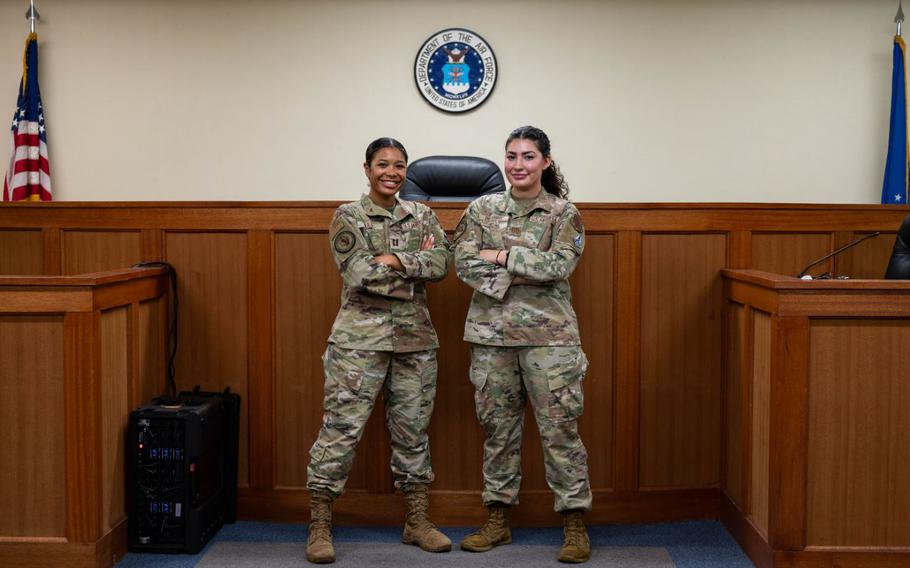 U.S. Air Force Capt. Angelique Lee, left, and Capt. Daina Pizarro, Trial Defense Division, Area Defense Counsels, pose for a photo at Kadena Air Base, Japan.