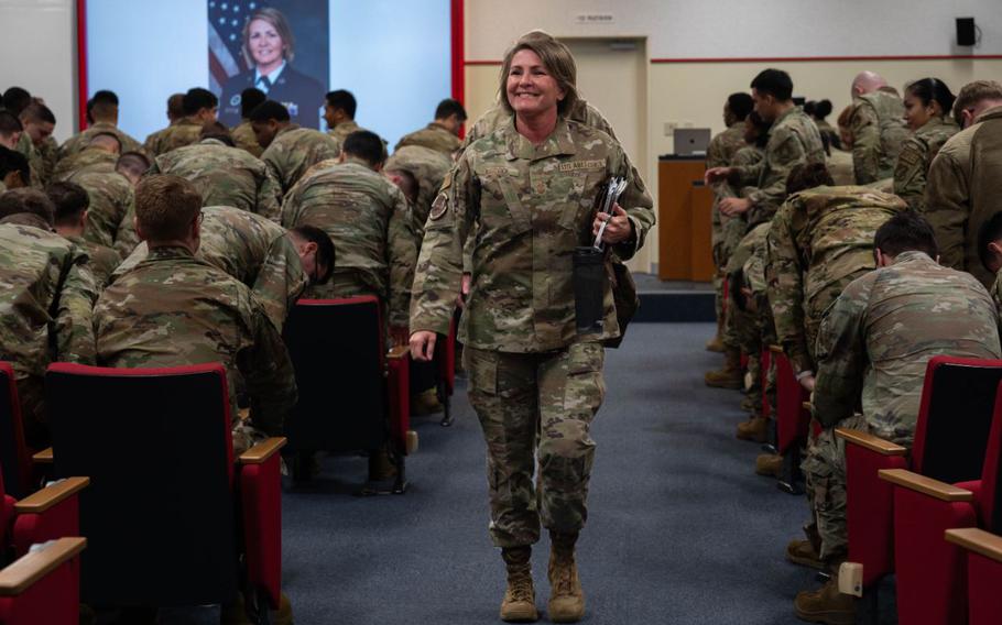 U.S. Air Force Chief Master Sgt. Katie McCool, Pacific Air Forces command chief walks in the Airman Leadership School at Kadena Air Base.