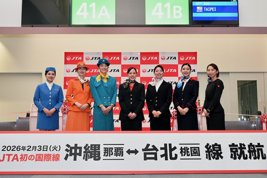 Japan Transocean Air cabin crew in historic uniforms at Naha Airport