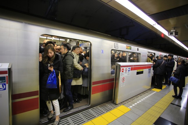 crowd of commuters in tokyo