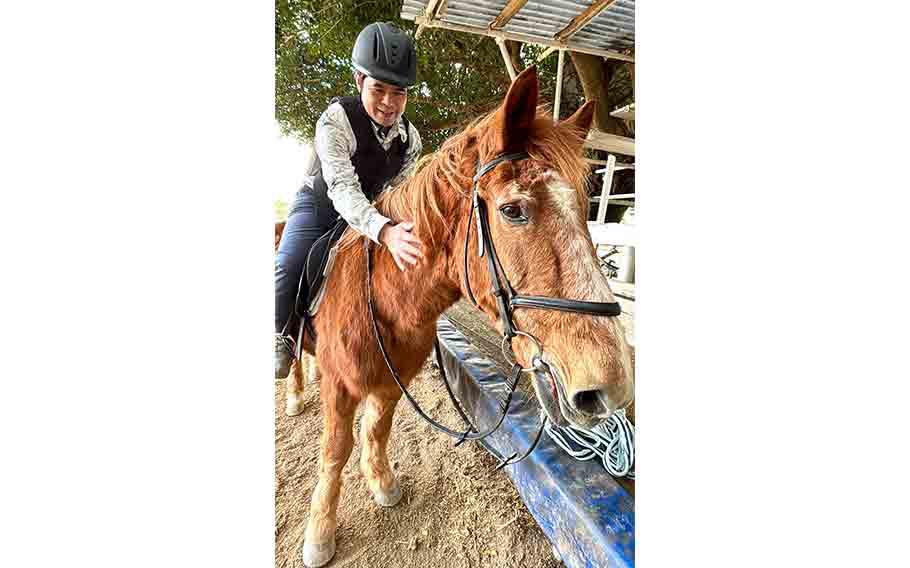 Shoji riding a horse