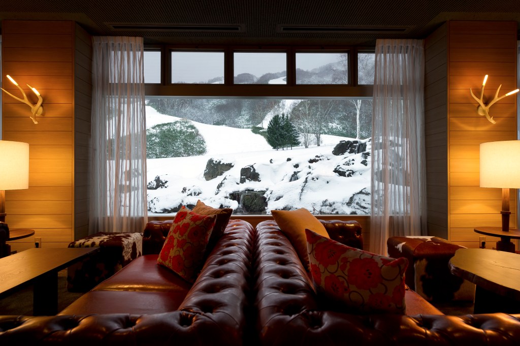 two cozy seating areas framed by window and snowy backdrop