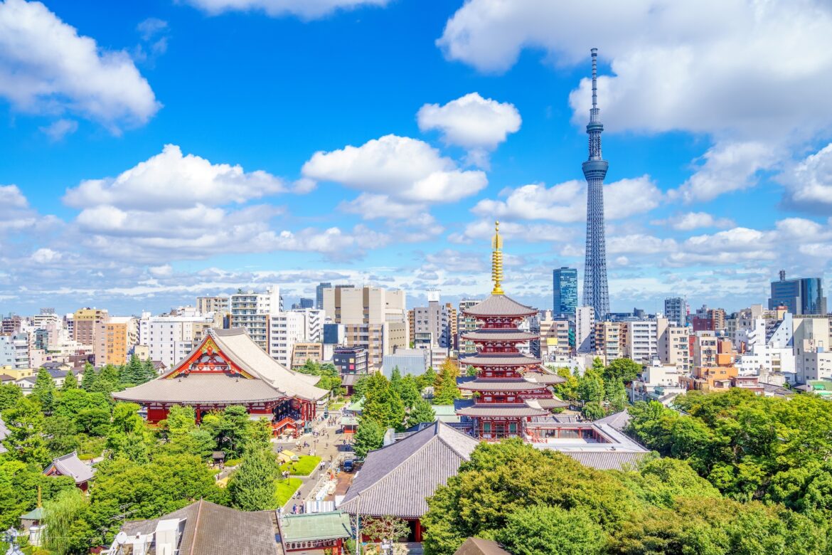 Florida Launches First Direct Flights to Japan photo of an aerial view of Tokyo showing temples and buildings among trees beneath the sky