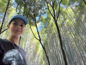 In the Arashiyama Bamboo Grove (Sagano Bamboo Forest), near Kyoto.