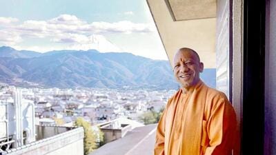 Uttar Pradesh chief minister Yogi Adityanath with a part of Mount Fuji in the background. (ANI)