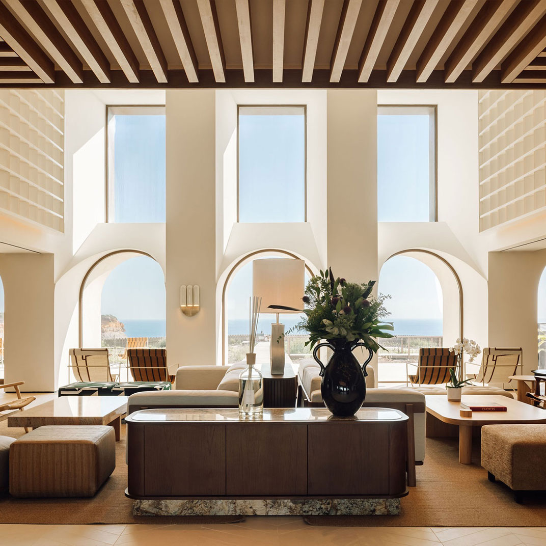 The surf-centric boutique hotel sits 40 meters above Calada Beach on a sandstone bluff. © Aethos Ericeira