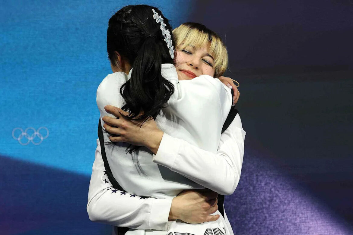 Alysa Liu Shares the Backstory on Her Viral Hug with Japan’s Ami Nakai After They Medaled at 2026 Winter Olympics (Exclusive)