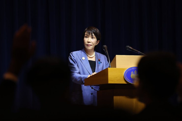 Japan Prime Minister Sanae Takaichi speaking at a press conference, highlighting her leadership and political agenda