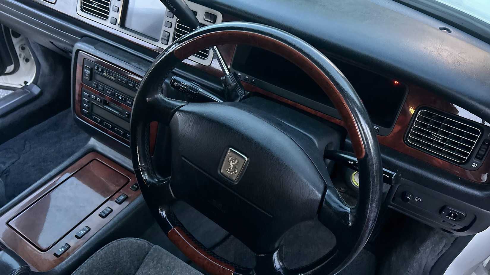 1997 Toyota Century G50 interior showing steering wheel and central column