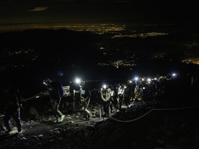 A river of headlamps on Mount Fuji.