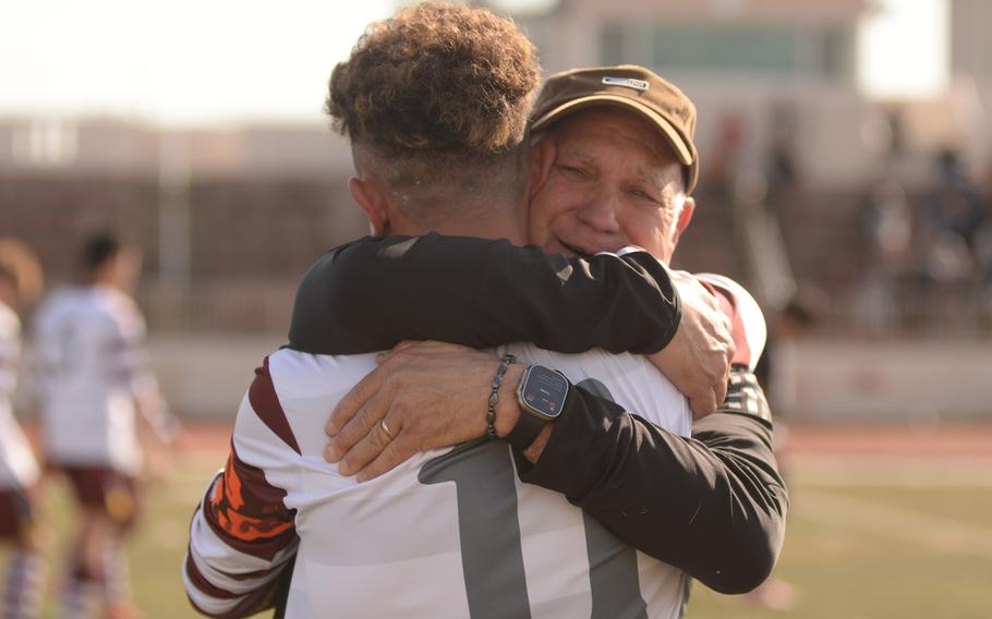 Mark Lane and Ren Spinosi hug.