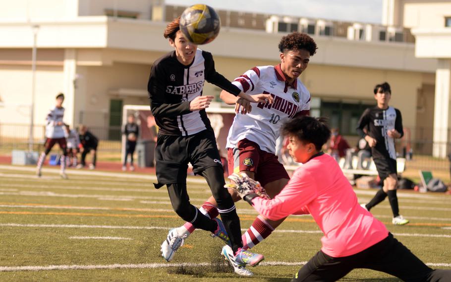 Senri Osaka and Perry players battle for the ball.