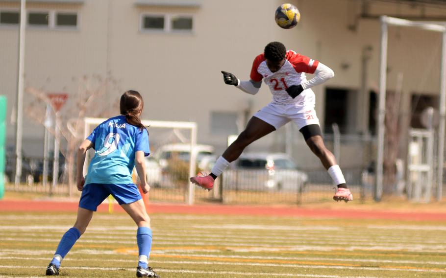 Koboyo Awesso heads the ball.