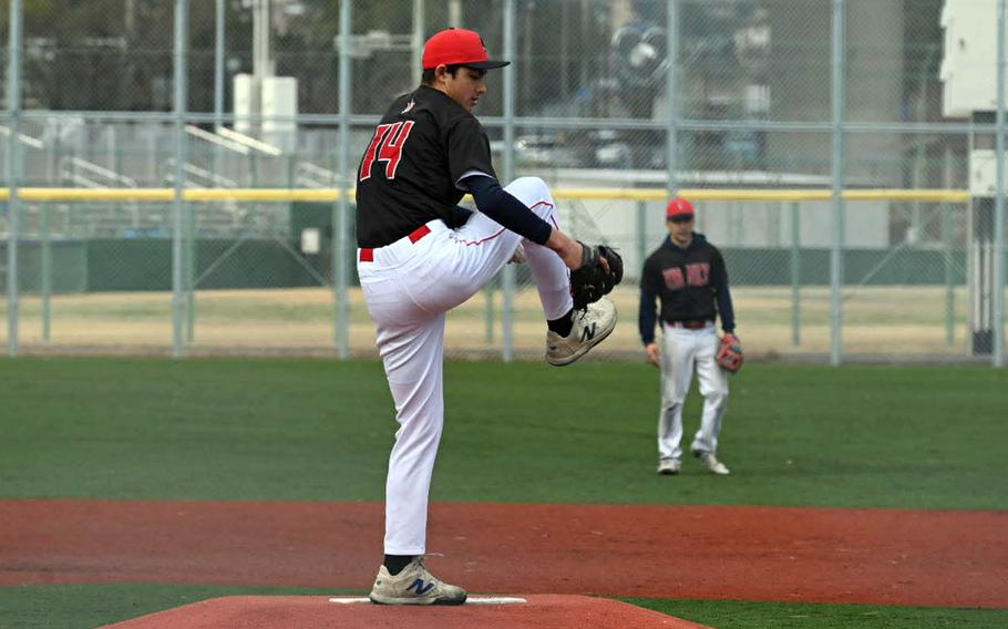 Kaiden Conley winds up to throw home.