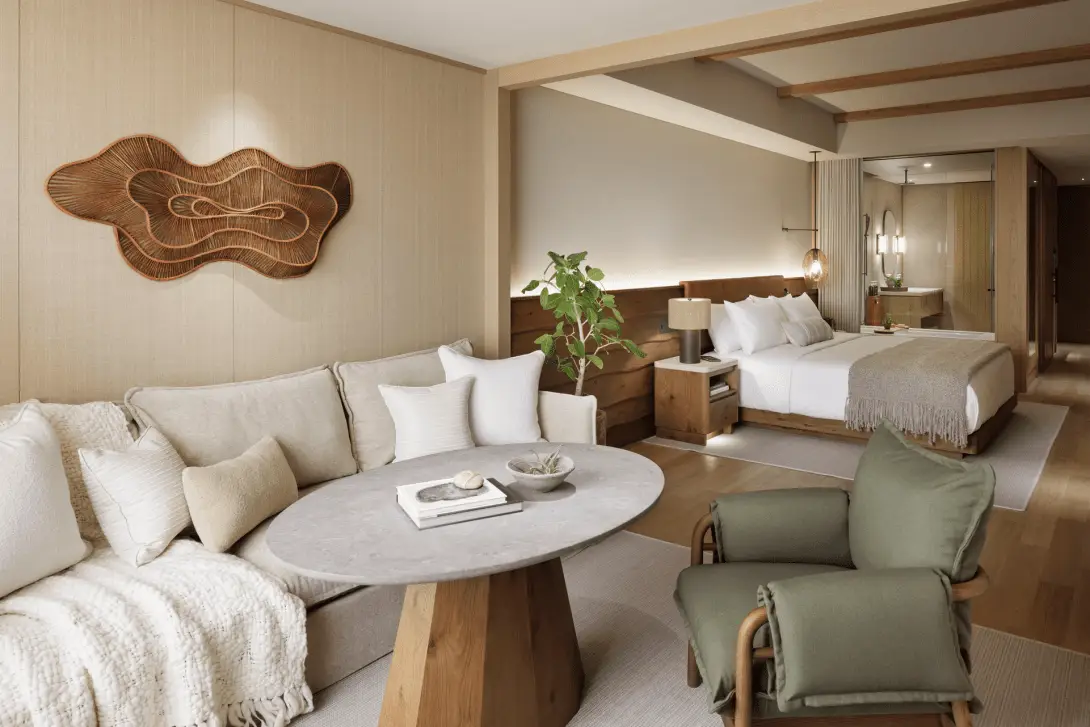 Luxury Lifestyle Brand, 1 Hotels, Debuts Its Nature-Infused Urban Sanctuary In Japan 3 1 Hotel Tokyo guestroom with natural wood design, neutral tones, biophilic decor, and open-plan bedroom and lounge area